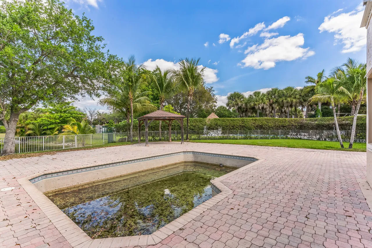 Distressed property rear exterior and lot