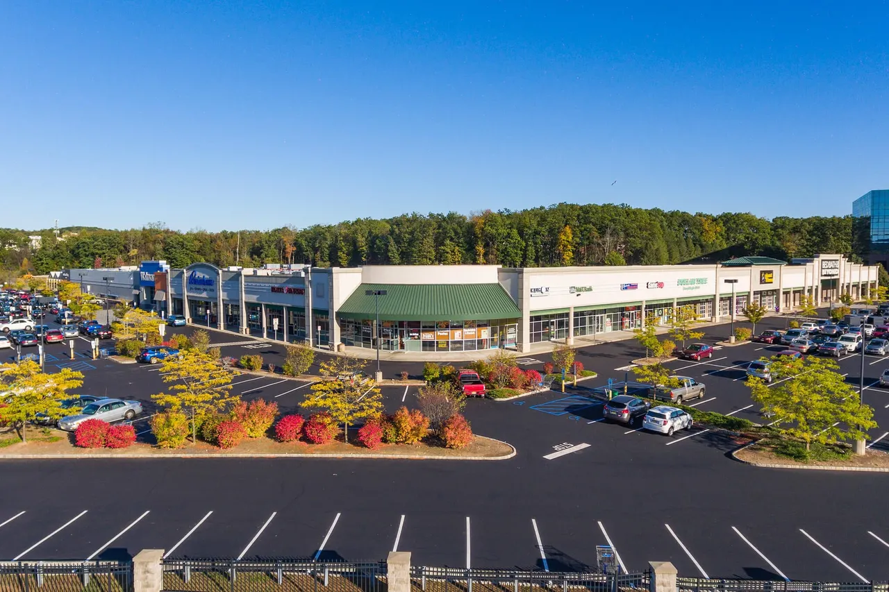 Aerial view of a neighborhood with local shops and greenery
